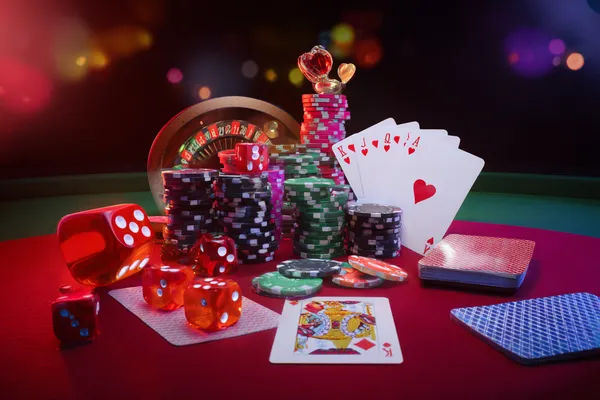 A player using their smartphone during a festive local event, representing HOKI678’s fully mobile-friendly casino.