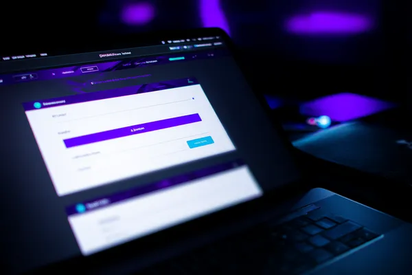 A confident dealer surrounded by casino chips inviting players to access their HOKI678 account, reflecting quick and easy login options.