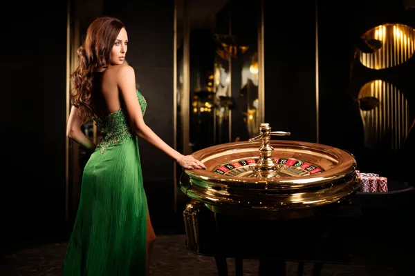 A person using their device against a moody casino-themed background, illustrating the smooth re-entry process at HOKI678.